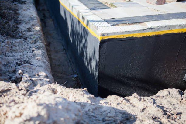 Professional Basement Waterproofing technician working in Shortsville, NY